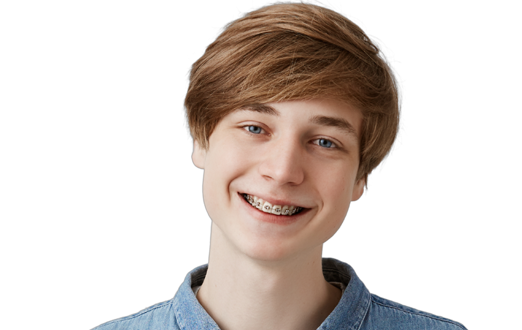 a photo of a male teen smiling with braces