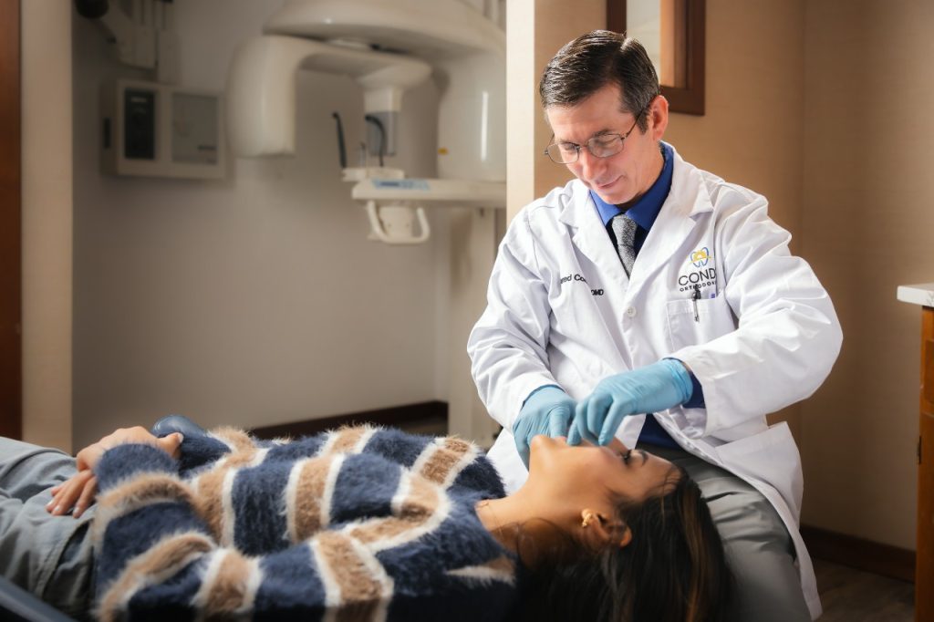 Dr. Condie performing a braces procedure