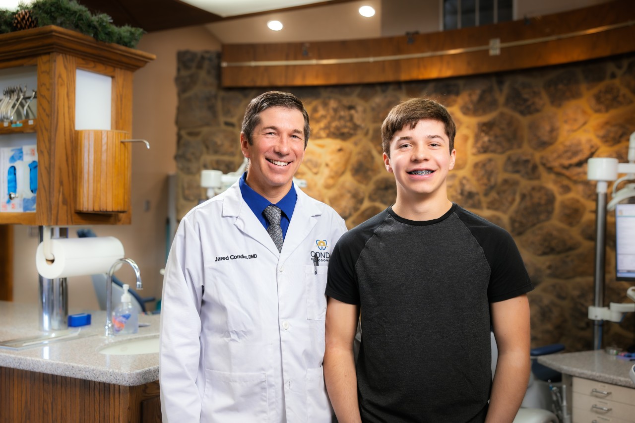 Dr. Condie with teen patient wearing braces